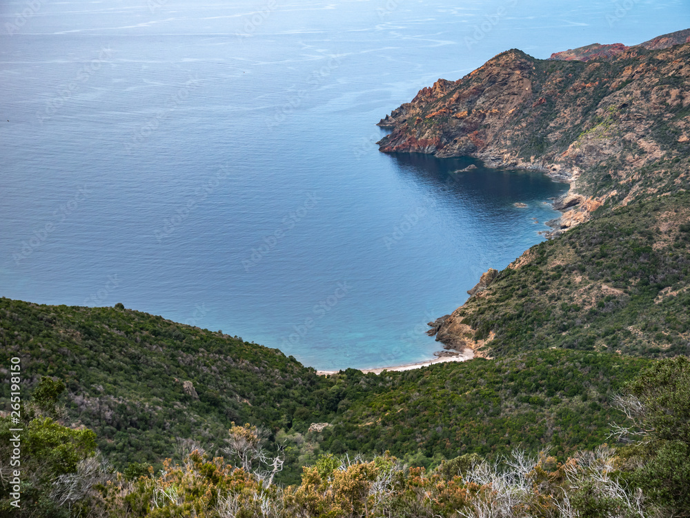 path from Galeria to Girolata with red cliffs. panorama of Scandola Nature Reserve a Natural World Heritage Site, Corsica Regional Park, France