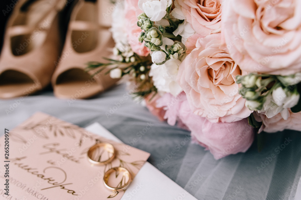 Beautiful decorated wedding invitations and wedding rings Beautiful decorated wedding invitations and wedding rings