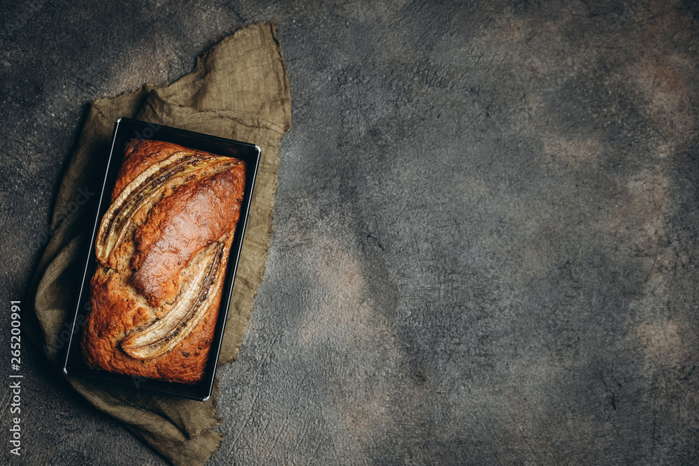 Banana bread with nuts, honey and mint on a dark background. Banana bread with nuts, honey and mint on a dark background.