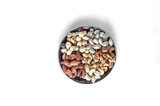Healthy food. Nuts mix assortment on white grey table top view. Collection of different legumes for background image close up nuts, pistachios, almond, cashew nuts, peanut, walnut. image