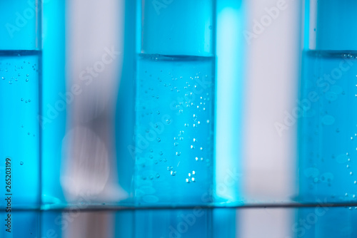 Test tube of glass overflows new liquid solution potassium blue conducts an analysis reaction takes various versions reagents using chemical pharmaceutics cancer manufacturing