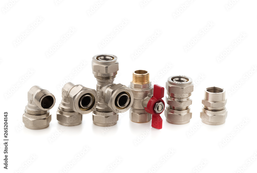 Fittings for water on a white background. Brass fittings close-up. Fittings for water on a white background. Brass fittings close-up.