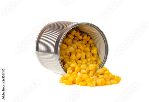 Canned corn on a white background. Corn closeup in an iron jar on a white background.