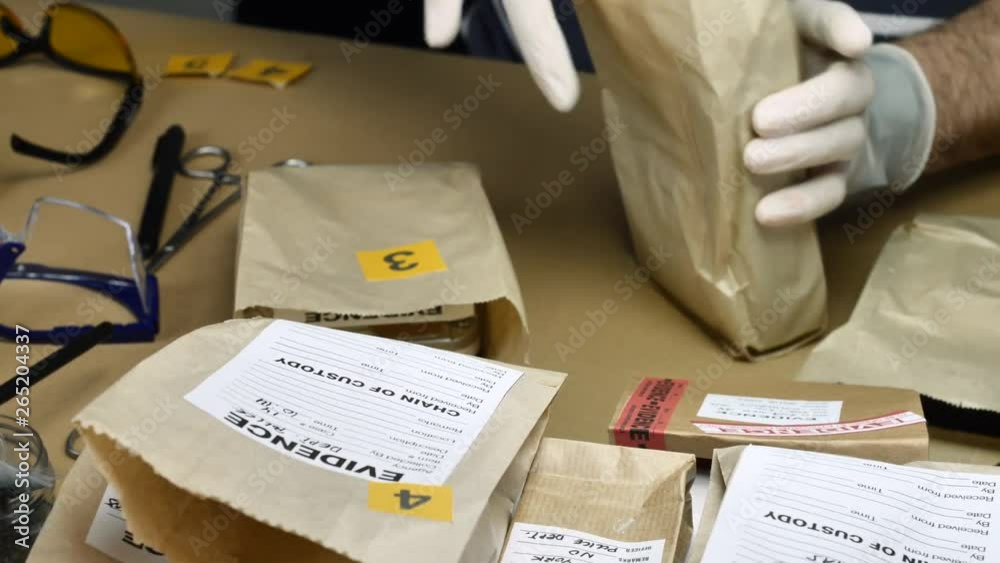 Police expert examines hard drive in search of evidence, conceptual image