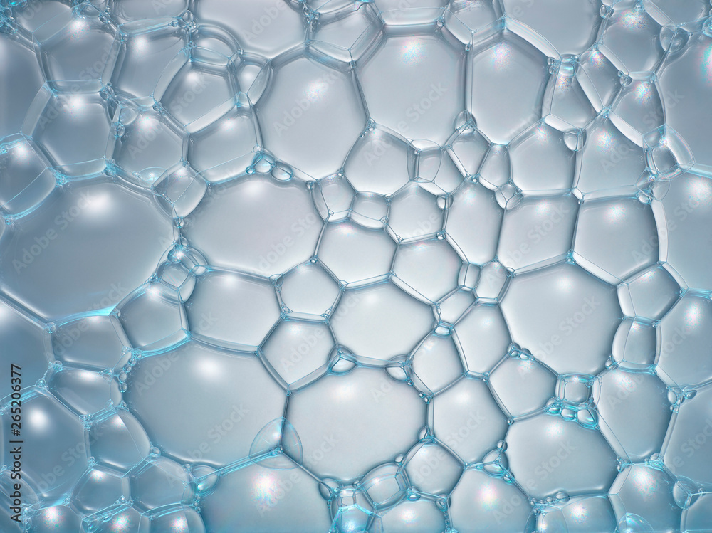 mousse de savon en macrophotographie, bulles de taille variable connectées entre elles