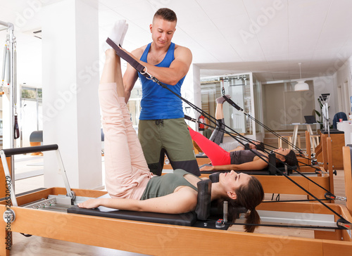 people in the gym with modern fitness equipment