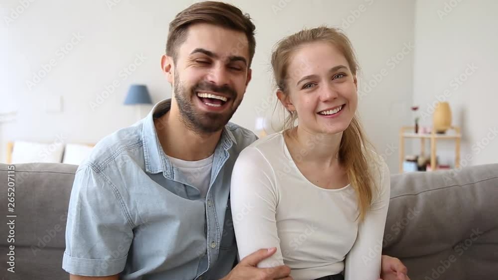 Happy couple vloggers recording vlog talking laughing looking at camera Happy couple vloggers recording vlog talking laughing looking at camera
