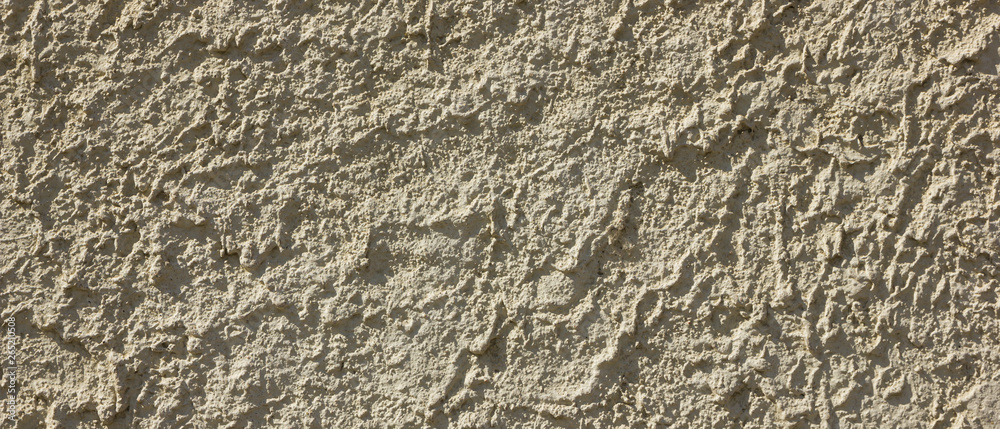 Background of the old wall. Texture of stone surface. Abstract background in retro style. Brown surface of solid material Background of the old wall. Texture of stone surface. Abstract background in retro style. Brown surface of solid material
