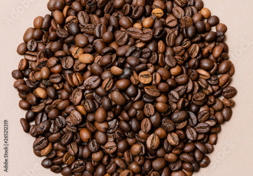 heap of coffee beans on paper background