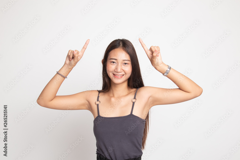 Young Asian woman point to blank space. Young Asian woman point to blank space.