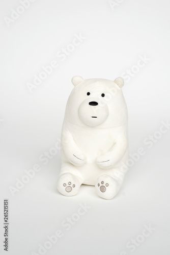  soft toy on a white background. children s teddy polar bear sitting on a knitted chair