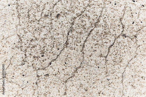 Eroding & cracking white concrete surface.