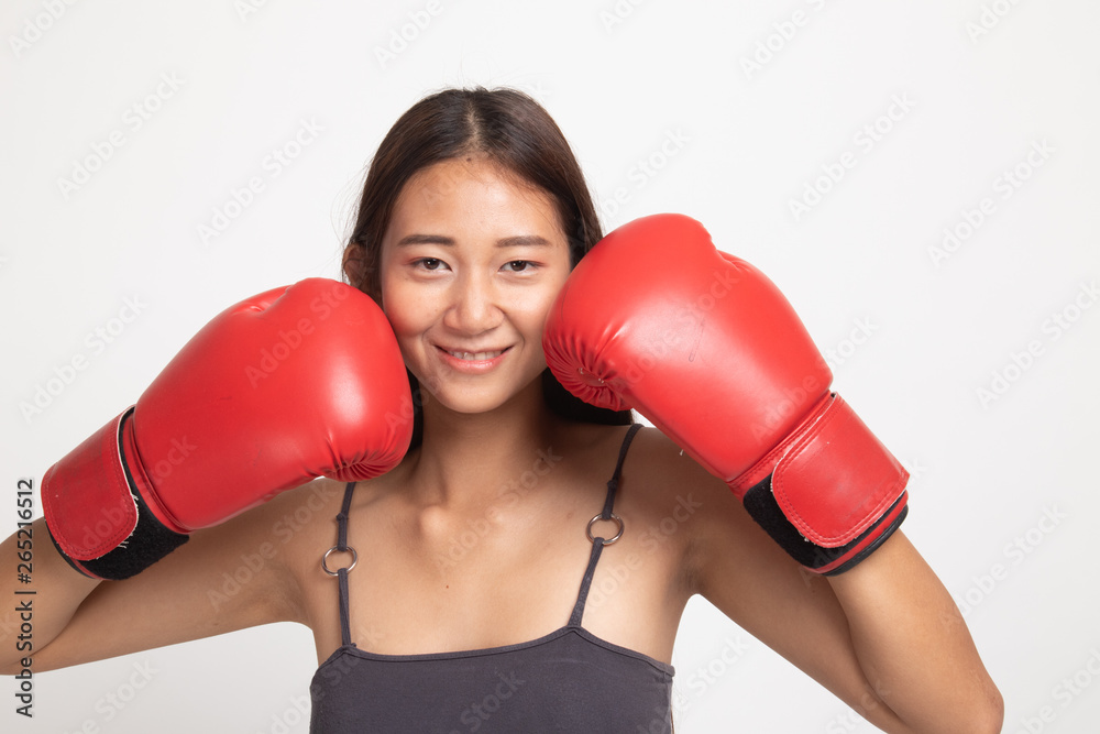 Young Asian woman with red boxing gloves. Young Asian woman with red boxing gloves.