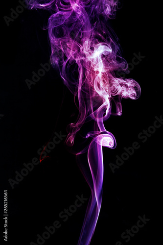 Colorful smoke on dark background © flydragon
