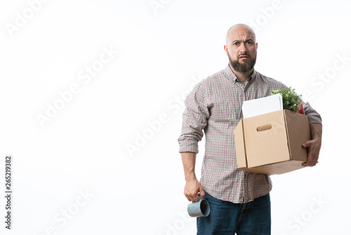 Fired businessman holding box with personal belongings.