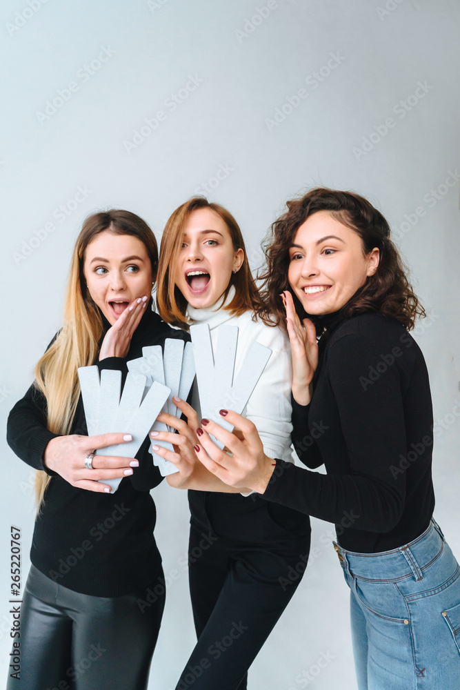 Three beautiful young girls posing for the camera Three beautiful young girls posing for the camera