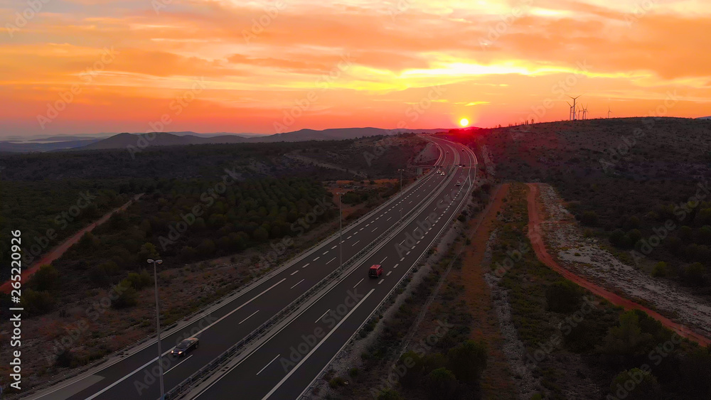 DRONE: Tourist cars speeding along the new freeway leading towards the seaside