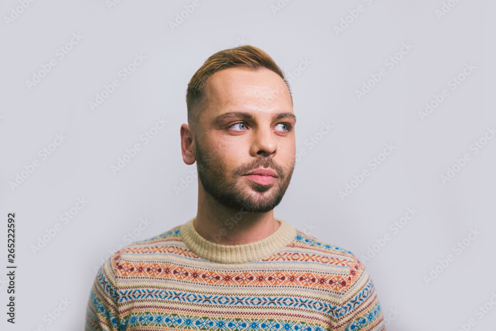 Fototapeta premium Portrait of a young caucasian stylish and fashionable man with a beard. Homosexual man, gay model posing