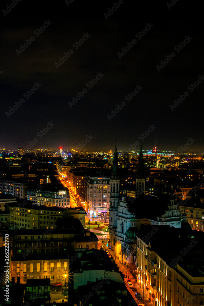 Cityscape with night above