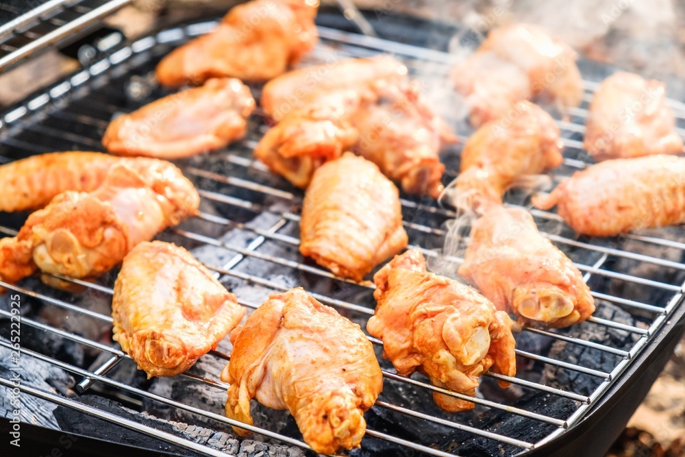 Barbecue chicken wings grilling fire,  meat.