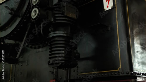 A caution sign on an old steam locomotive photo