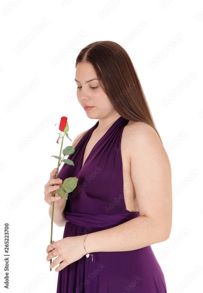 Lovely teenager girl holding a red rose Lovely teenager girl holding a red rose
