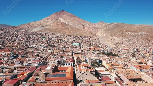 Flight over the city of Potosi with the mountain of Cerro Rico (which has the world's largest silver deposit) on the background, Bolivia photo