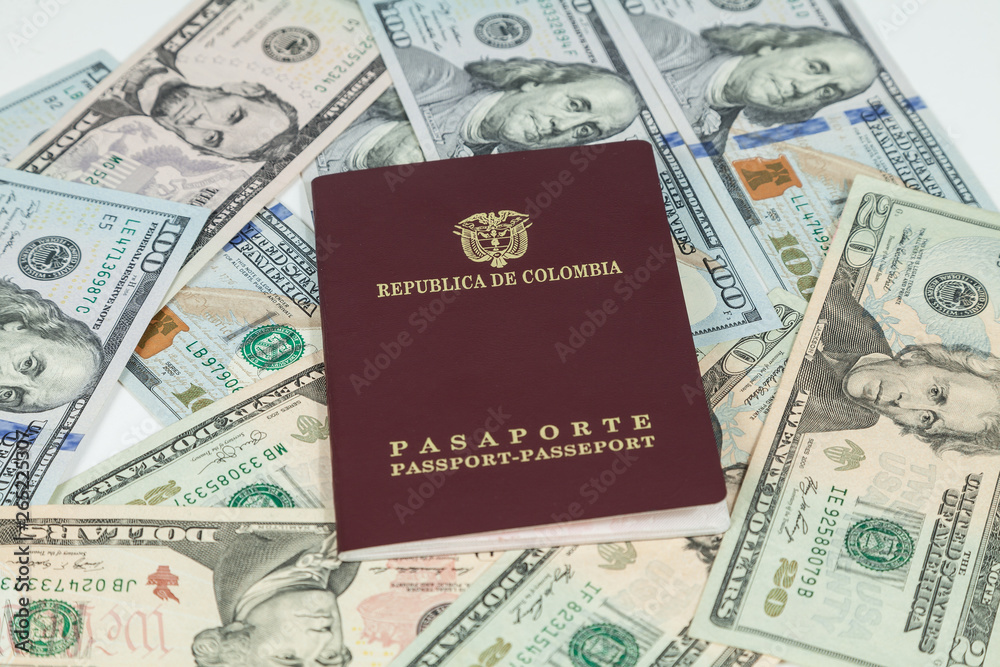 travel concept, Colombian passport with dollar bills for travel abroad travel concept, Colombian passport with dollar bills for travel abroad