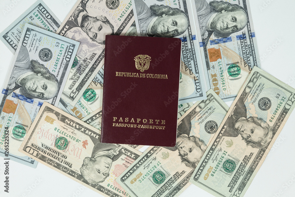 travel concept, Colombian passport with dollar bills for travel abroad travel concept, Colombian passport with dollar bills for travel abroad