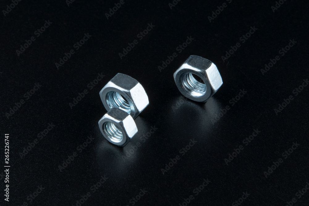 Three metal nuts