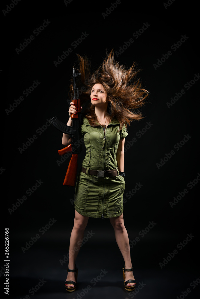 Fototapeta premium Woman holding gun