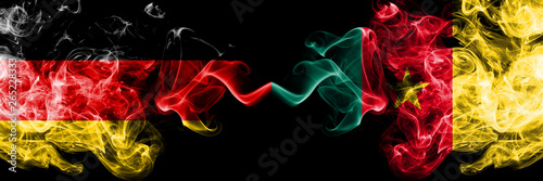 Germany vs Cameroon, Cameroonian smoky mystic flags placed side by side. Thick colored silky smoke flags of Deutschland and Cameroon, Cameroonian