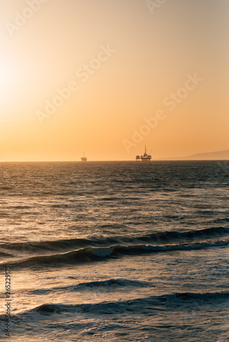 Waves in the Pacific Ocean at sunset, in Huntington Beach, Orange County, California