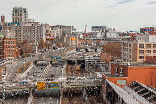 Looking down a freeway and subway tracks in urban Boston