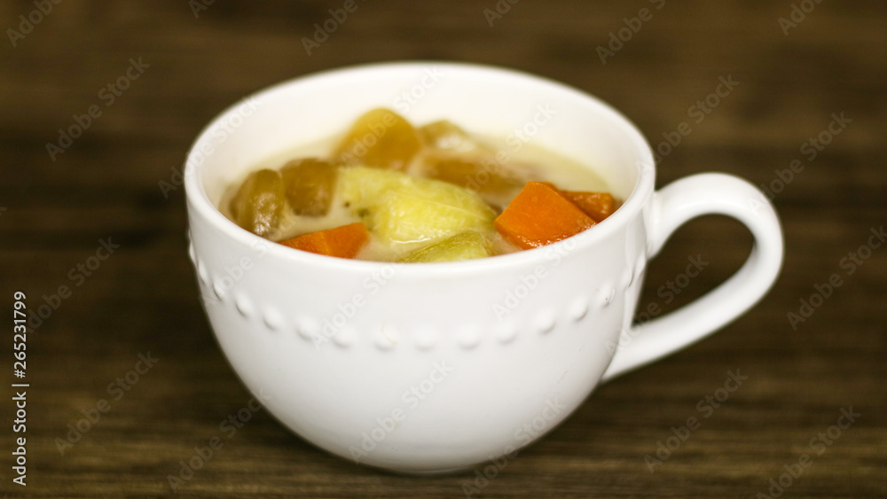 Indonesian sweet desserts or kolak on wood background. Indonesian sweet desserts or kolak on wood background.