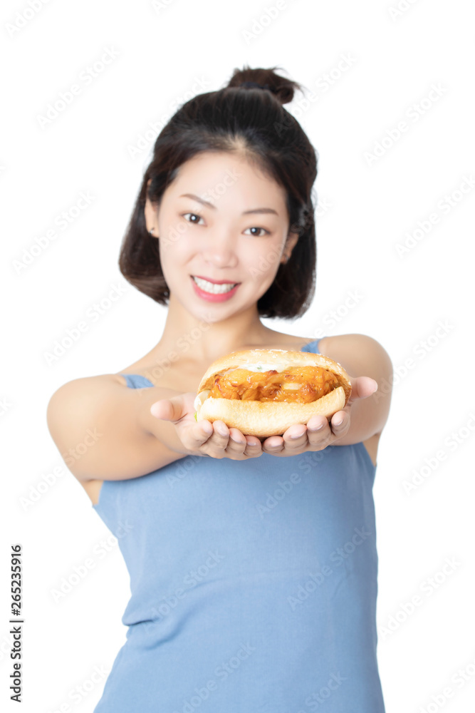 Chinese American woman eating Chicken Sandwich isolated on white background