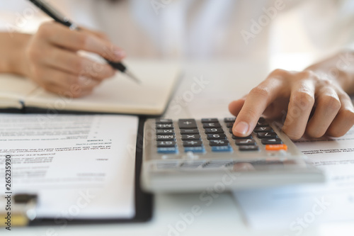 close up view hand of person calculating income balance.