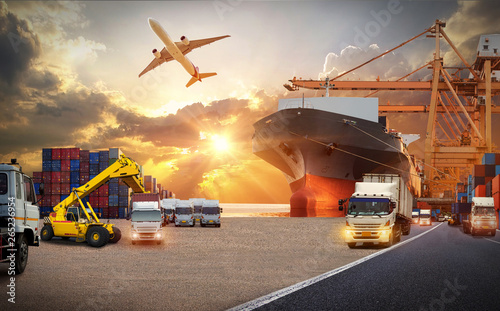 Container truck in ship port for business Logistics and transportation of Container Cargo ship and Cargo plane with working crane bridge in shipyard at sunrise  logistic import export and transport 