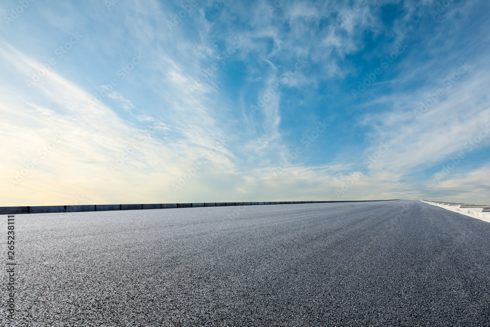 Fototapeta premium Asphalt road and sky cloud background