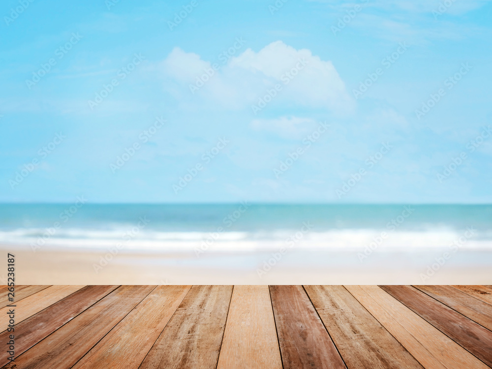 Wood table top over summer beach and blue sky Wood table top over summer beach and blue sky