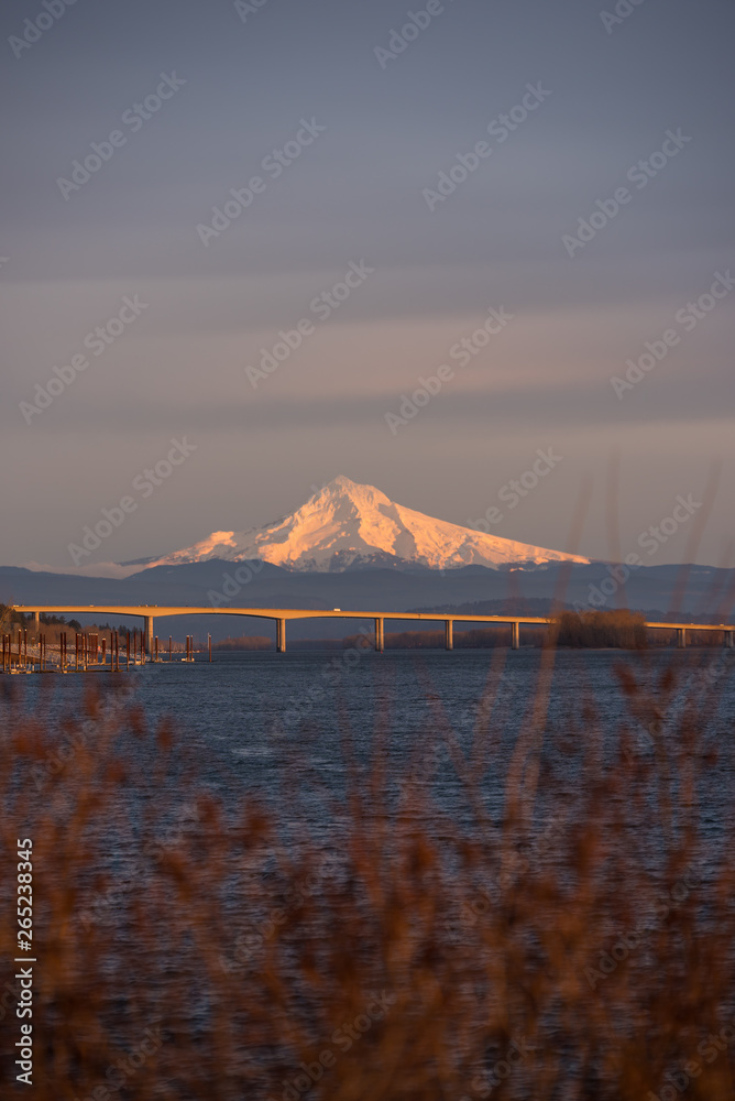 Mt Hood glowing in the last light of the evening over the Columbia River in Vancouver Washington
