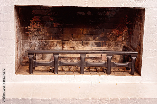 Valokuva A Fireplace Surrounded By White Bricks
