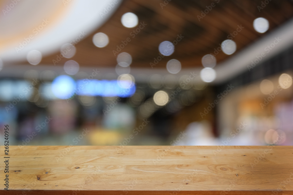 Empty dark wooden table in front of abstract blurred bokeh background of restaurant . can be used for display or montage your products.Mock up for space. Empty dark wooden table in front of abstract blurred bokeh background of restaurant . can be used for display or montage your products.Mock up for space.