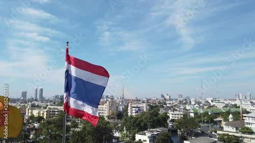 Thai Flag waving on the top of the old bangkok town khaosarn road photo
