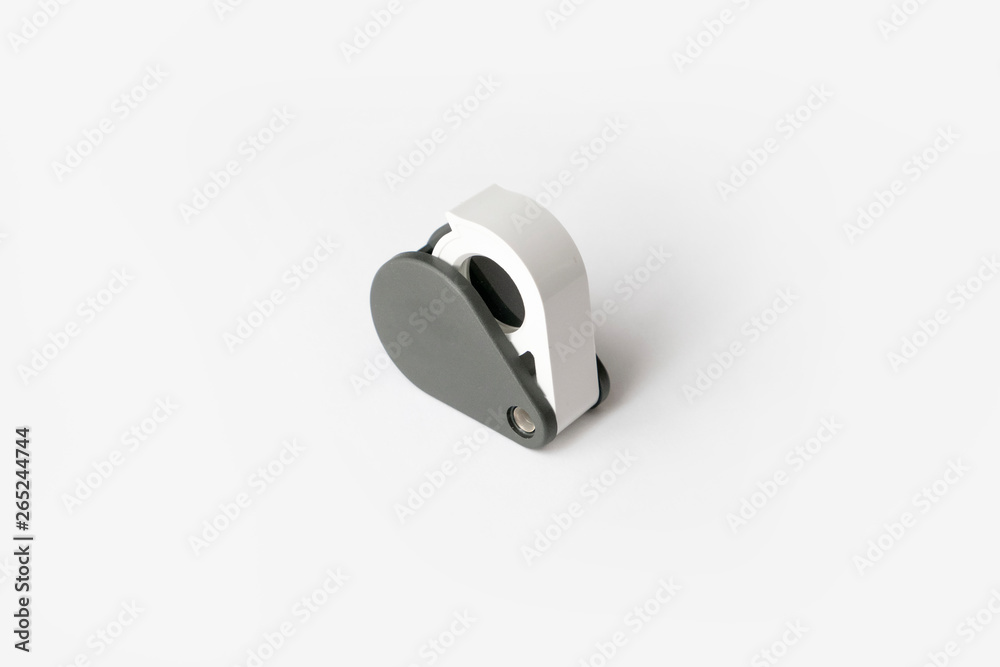 Magnifying glass for diamonds or see the amulet Isolated on a White Background. Magnifying glass for diamonds or see the amulet Isolated on a White Background.