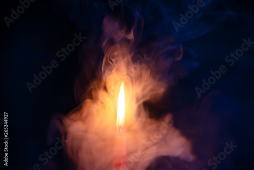 Fire with smoke, blue and orange gradient texture on a black background. Warm glow texture with fire.