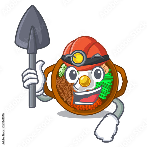 Miner plate containing bibimbap cartoon on table