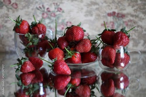 Ripe red strawberries lying on the table