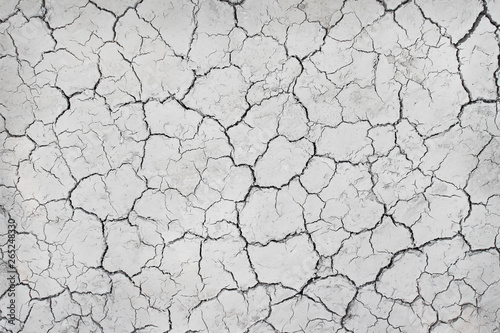 Cracked soil ground texture top view , line nature drought seamless patterns grey white background
