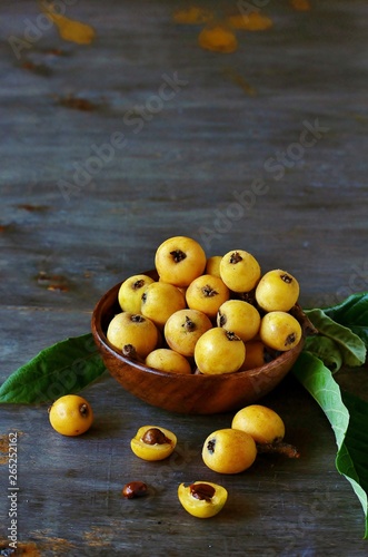 loquat japanese on a blue background. copy space.